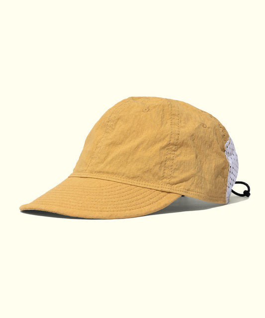 Yellow cap with a white mesh back on a white background