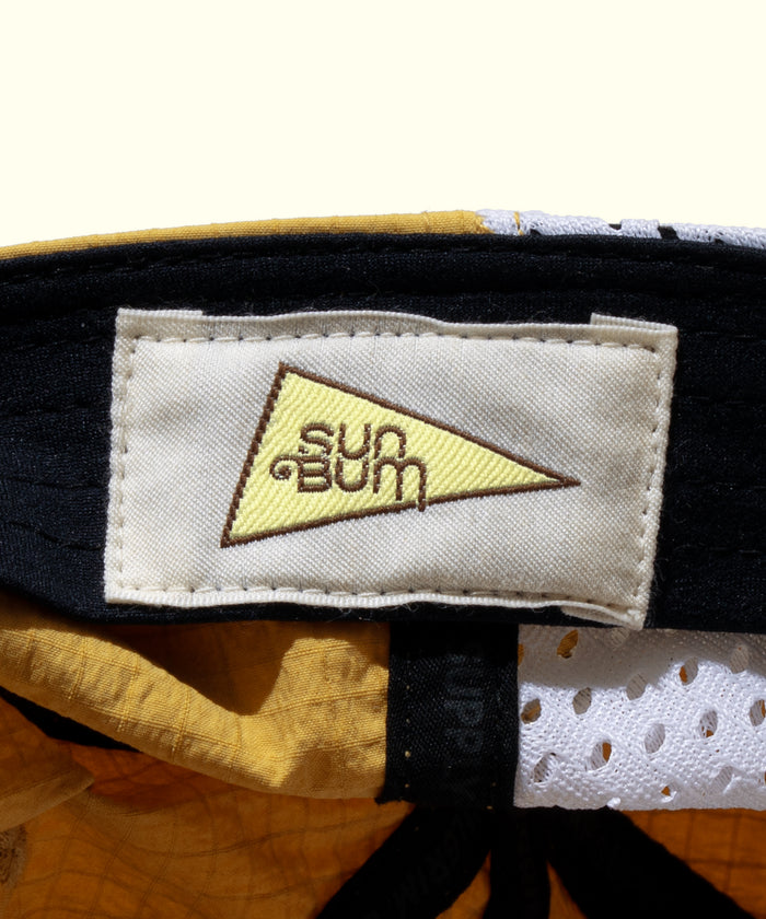 Close-up of a Sun Bum label on a cap with a white background