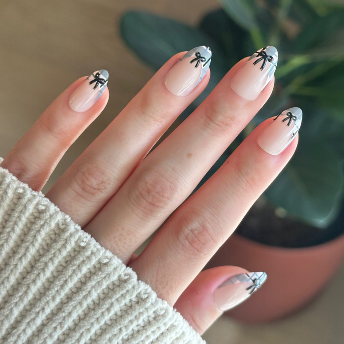 Plaid Print with Bows French - Press-On | Medium | Almond neutral nails with grey plaid tips and black bow accents for an easy mani