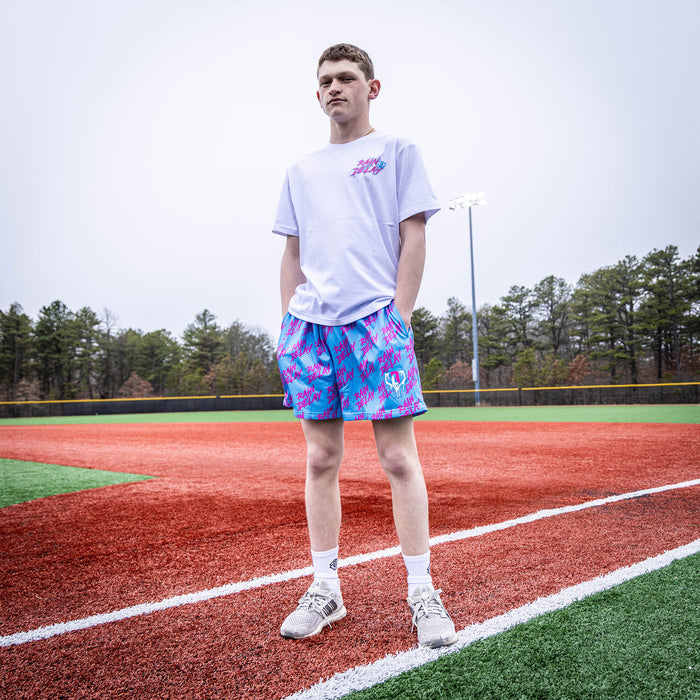 Adult model wearing blue Rain Delay Cotton Candy shorts
