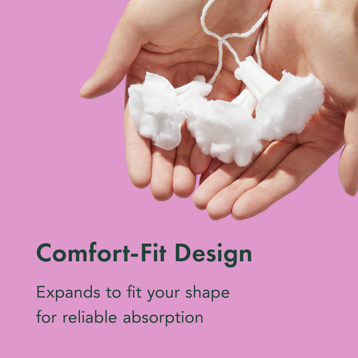 Hands holding cotton pads with text about comfort-fit design on a pink background