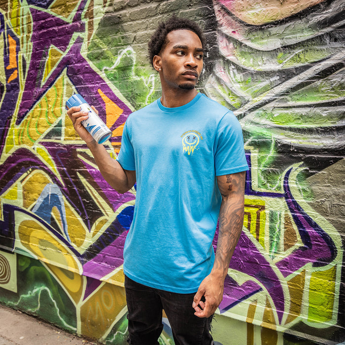 Adult model wearing blue and yellow Retro Graffiti graphic tee