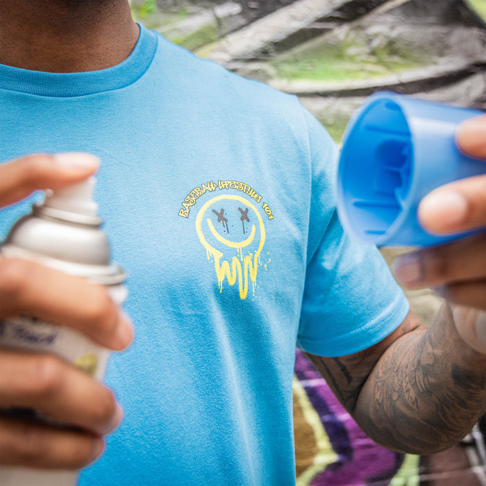 Adult model wearing blue and yellow Retro Graffiti graphic tee