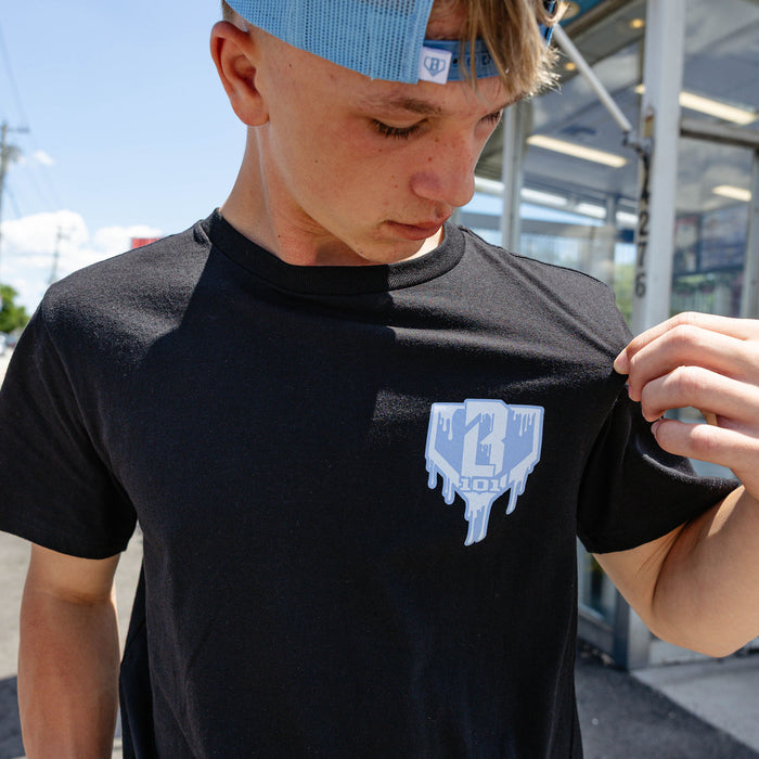 Adult model wearing graphic tee with "Scoop SZN" design