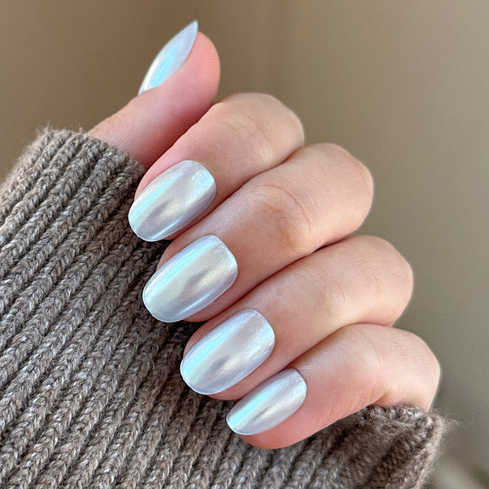 Sky Chrome - Press-On | Short | Round nails in shiny pale blue chrome finish for an easy at-home manicure look