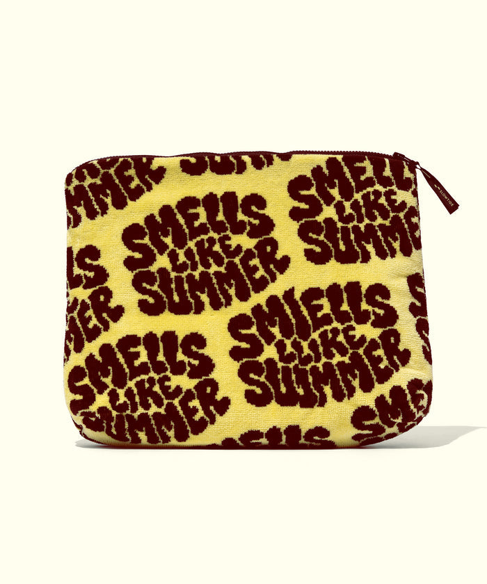 Yellow pouch with 'Smells Like Summer' text pattern on a white background