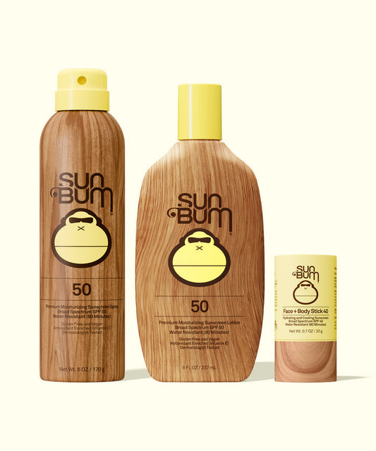 Sun Bum SPF 50 Spray + Lotion + Face and Body Stick 40 with yellow caps in wood-textured packaging