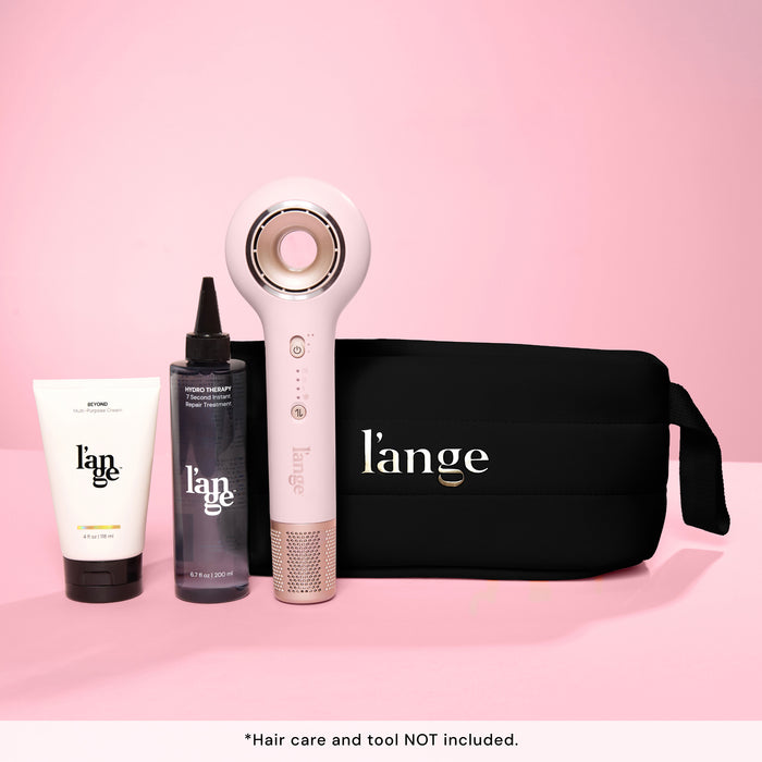 L’ange essential bag with hair dryer and two hair care products on the side. Text reads "hair care and tool NOT included"