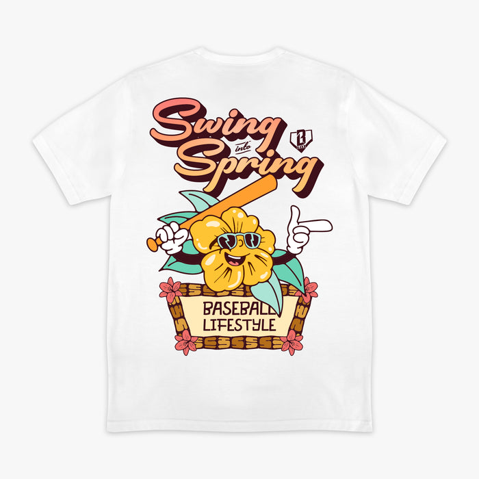 White t-shirt with a cartoon flower character holding a baseball bat and sunglasses, with text 'Swing into Spring' and 'Baseball Lifestyle'.