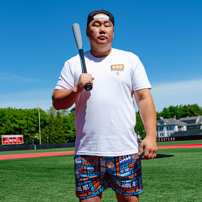 Adult model wearing navy shorts with "Trash Talk" design