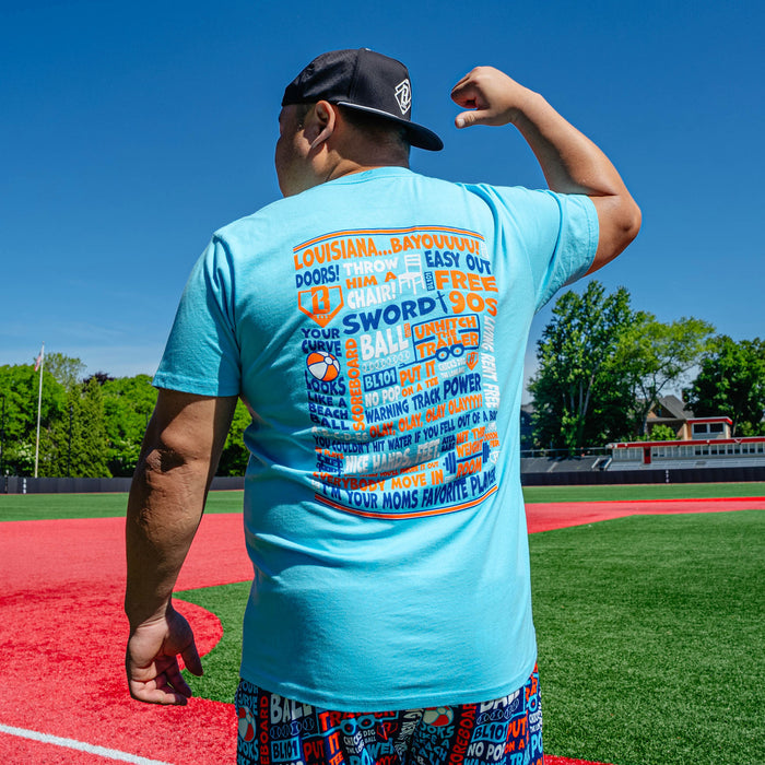 Adult model wearing blue graphic tee with "Trash Talk" design