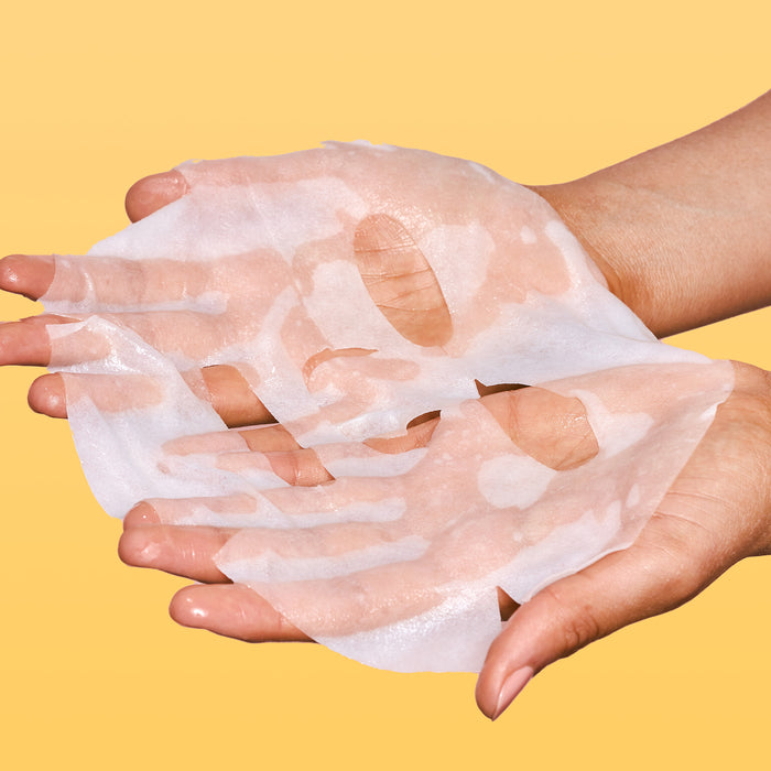 Rael Face Sheet Mask in hands.