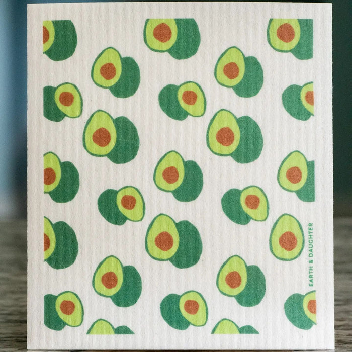 Dish washing sponge cloth with green avocado pattern; “EARTH DAUGHTER” label on side