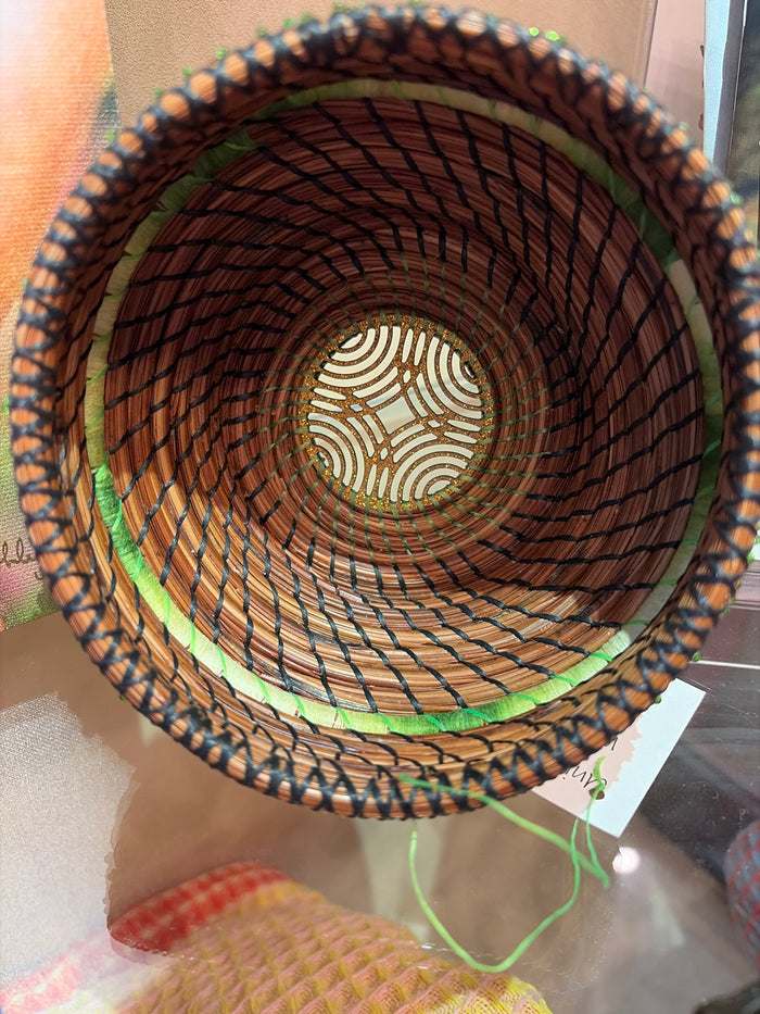 Handwoven Pine Needle Baskets by Whispers of Pine, showcasing intricate woven patterns and natural earthy tones.